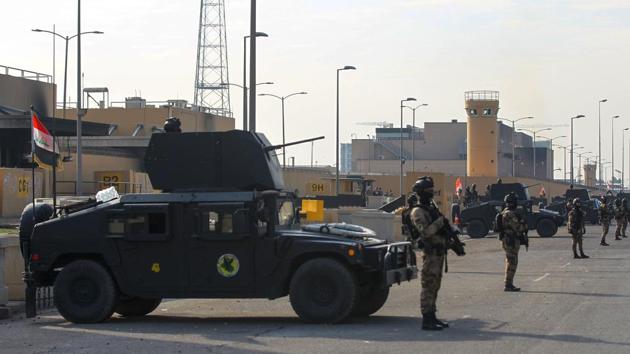 Iraqi counter-terrorism forces stand guard in front of the US embassy in the capital Baghdad. (Photo by AHMAD AL-RUBAYE / AFP) (AFP) Iraqi counter-terrorism forces stand guard in front of the US embassy in the capital Baghdad. (Photo by AHMAD AL-RUBAYE / AFP) (AFP)