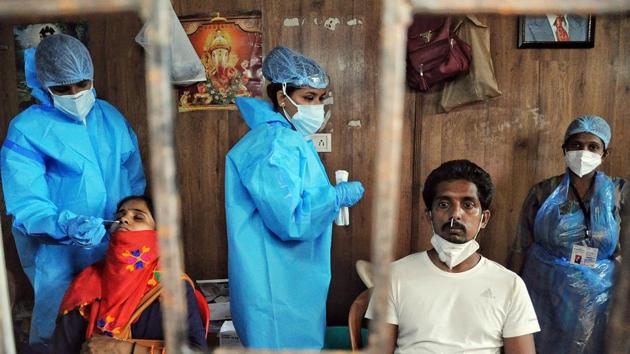 Heath workers collect nasal samples for Covid-19 test, in Mumbai. (ANI file)