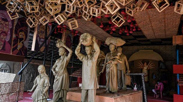 A view of a pandal, highlighting the migrant exodus from the nationwide Covid-19 lockdown, in Kolkata on October 17. Some of the pandals were inaugurated by migrant workers on October 19 and residents in the area maintained a minute’s silence to mourn the passing of migrant workers who died on the way back home. (Dibyangshu Sarkar / AFP)