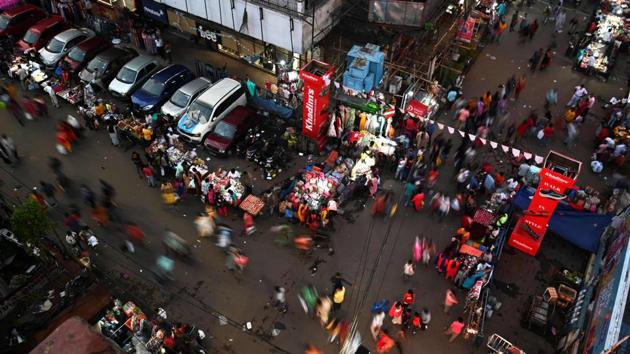 A bustling marketplace ahead of Durga Puja, in Kolkata on October 19. Approaching celebrations for the Durga Puja and Diwali due this month and in mid-November respectively, come with concerns that festive gatherings may result in a spike in cases with guards being lowered and as winter looming ahead. (Dibyangshu Sarkar / AFP)