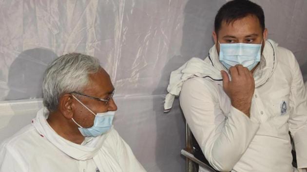 RJD leader Tejashwi Yadav (right) with Bihar chief minister Nitish Kumar in Patna on Tuesday.(Santosh Kumar/HT Photo)