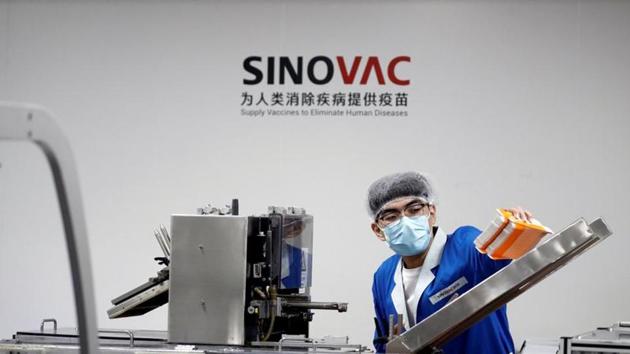 A man works in the packaging facility of Chinese vaccine maker Sinovac Biotech.(REUTERS)