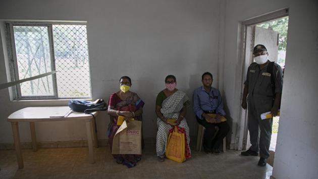 People wait to be tested for Covid-19 during a random test for family members of army personnel at the army base hospital in Guwahati on October 19. The national recovery rate of has now gone up to 88.81%. Health ministry data shows 679,5103 Covid-19 patients recovered in the last 24 hours. (Anupam Nath / AP)