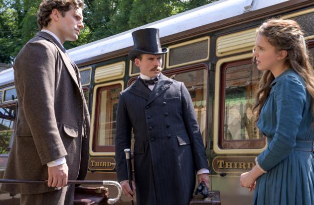 Millie Bobby Brown, Henry Cavill and Sam Claflin in a still from Enola Holmes.