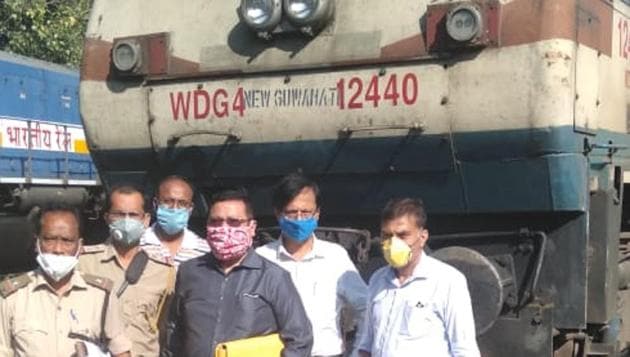 Forest officials with the seized railway locomotive. (HT Photo) Forest officials with the seized railway locomotive. (HT Photo)