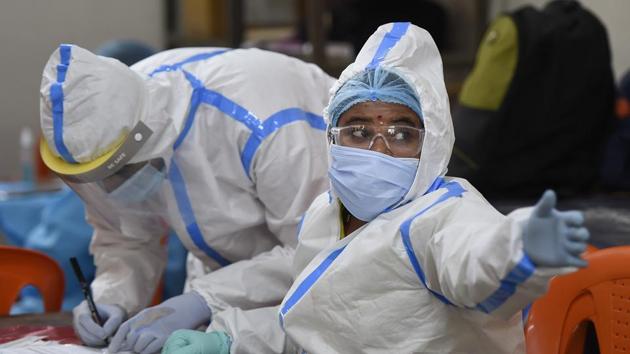 Health workers collect samples via Rapid Antigen kit for Covid-19 test in Mumbai. (PTI) Health workers collect samples via Rapid Antigen kit for Covid-19 test in Mumbai. (PTI)