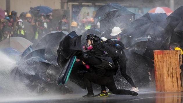 Hong Kong riot police fired tear gas and water cannons on September 15 at hardcore pro-democracy protesters hurling rocks and petrol bombs, in a return to the political chaos plaguing the city(AFP)