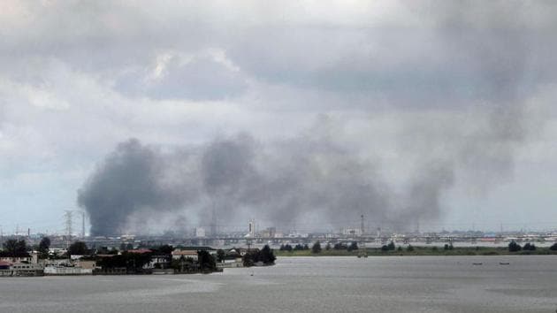 Smoke rises from Lagos mainland on October 21. Fires were burning across Lagos on October 21 and residents of Ebute Mette, Lagos island and Okota reported hearing gunfire. (Jacob Parakilas / REUTERS)