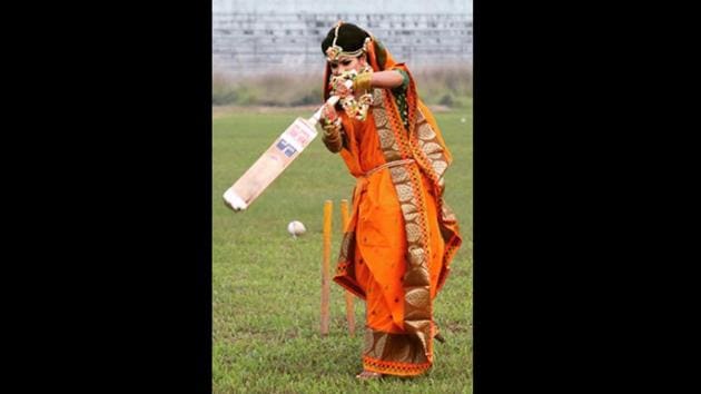The image shows Sanjida Islam wearing a sari and playing cricket.(Instagram/@mistycricketer_10)