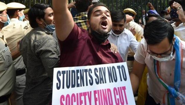 New Delhi: National Students' Union of India (NSUI) activists protest against Delhi government and Delhi University administration demanding cancellation of the order to pay outstanding salaries of teachers and non teaching staff from Students Society Fund (SSF), near Arts Faculty in New Delhi, Tuesday (PTI) New Delhi: National Students' Union of India (NSUI) activists protest against Delhi government and Delhi University administration demanding cancellation of the order to pay outstanding salaries of teachers and non teaching staff from Students Society Fund (SSF), near Arts Faculty in New Delhi, Tuesday (PTI)