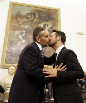 FILE - In this May 21, 2015 file photo, Mauro Cioffari, left, kisses Davide Conti as their civil union is being registered by a municipality officer during a ceremony in Rome's Campidoglio Capitol Hill. Pope Francis, the Jesuit priest who has been at the forefront in seeking to build bridges with gays in the church, the Rev. James Martin, praised the pope’s comments as “a major step forward in the church’s support for LGBT people.” (AP)