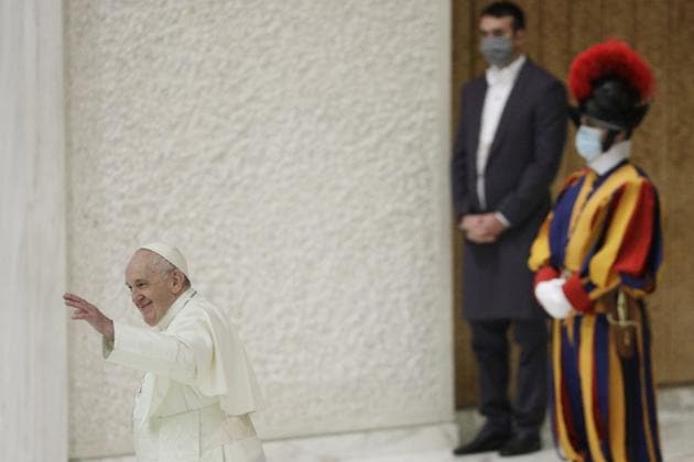 Pope Francis waves at the end of his weekly general audience in the Paul VI hall at the Vatican, Wednesday, Oct. 21, 2020. Pope Francis endorsed same-sex civil unions for the first time as pope while being interviewed for the feature-length documentary “Francesco,” which premiered Wednesday at the Rome Film Festival. (AP)