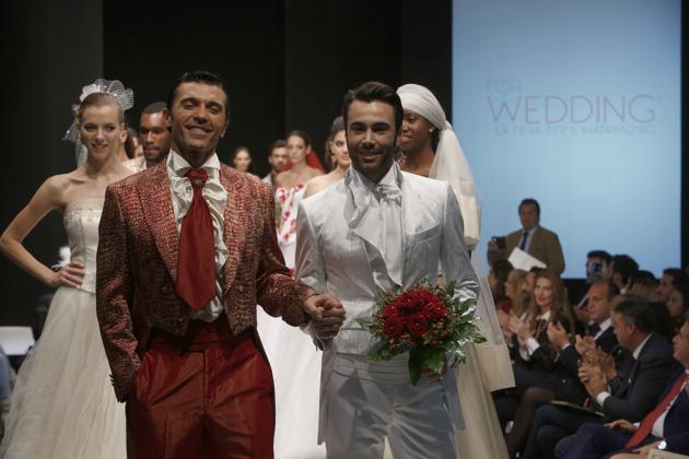 Models on the catwalk during a wedding fashion show with same-sex couples, dubbed "The rainbow wedding fashion show", part of a 'wedding fair' taking place in Rome, Thursday, Oct. 23, 2014. “Homosexual people have the right to be in a family. They are children of God,” Francis said in one of his sit-down interviews for the film. (AP)