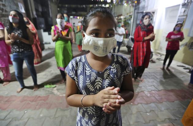 Indians, wearing face mask and maintaining physical distance, participate in religious rituals during Navratri or nine nights festival celebrations in Ahmedabad, India, Wednesday, Oct. 21, 2020. (Representational image) (AP) Indians, wearing face mask and maintaining physical distance, participate in religious rituals during Navratri or nine nights festival celebrations in Ahmedabad, India, Wednesday, Oct. 21, 2020. (Representational image) (AP)