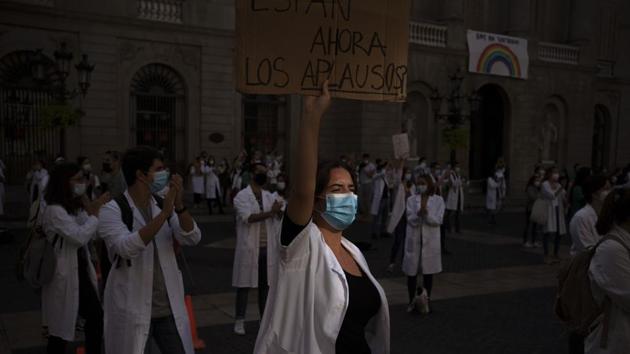 Medical resident doctors take part in a protest against working conditions in Barcelona on October 20. While daily deaths have been hovering around 100, hospital admissions have jumped 20% nationwide in two weeks and 70% in the affluent region of Catalonia alone. The Spanish government is contemplating curfews for the worst-hit areas, including the capital Madrid, where a two-week state of emergency ends on October 24. (Emilio Morenatti / AP)