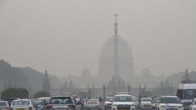 Vehicles ply amid a dense layer of smog at Rajpath, in New Delhi. (PTI) Vehicles ply amid a dense layer of smog at Rajpath, in New Delhi. (PTI)
