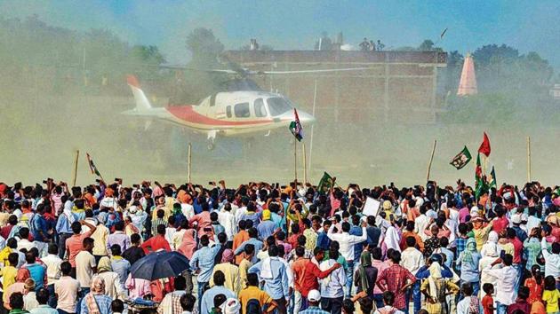 People wait as Rashtriya Janata Dal (RJD) leader Tejashwi Yadav arrives to address a rally in Aurangabad this week. (PTI)
