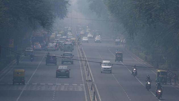 Vehicles move amid heavy haze near Supreme Court at Tilak Marg in New Delhi on October 22. The next steps, which come into force under the “severe” category -- if the AQI is above 400 for 48 hours -- are bans on the entry of trucks, on industries running on coal being asked to cease operations, and implementing odd-even road rationing for private vehicles. (Arvind Yadav / HT Photo)