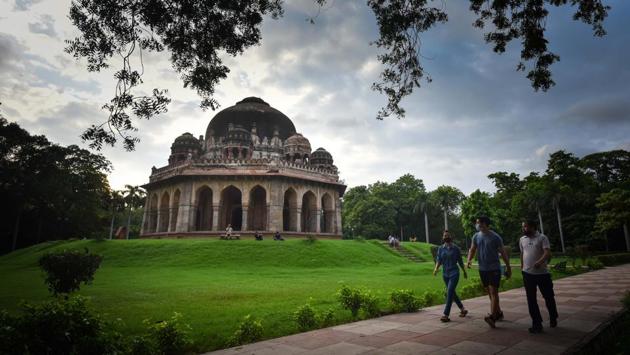 People walk past the tomb of Muhammad Shah in Lodhi Garden, New Delhi on August 30. Mukesh Khare, a professor at IIT-Delhi, told HT that while GRAP has proved effective in many countries, Delhi needs a re-evaluation of the strategy. “We need to revisit the plan and see what responses should be implemented under which category… there are multiple agencies responsible for enforcement, and action is lagging,” Khare said. (Sanchit Khanna / HT Photo)