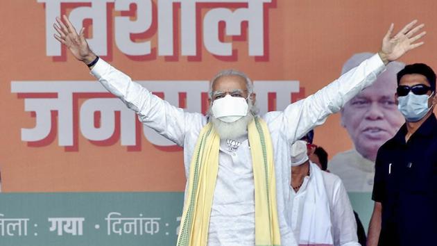 Prime Minister Narendra Modi waves at the crowd during an election rally, ahead of Bihar Assembly polls, in Gaya, on Oct 23, 2020.(PTI)