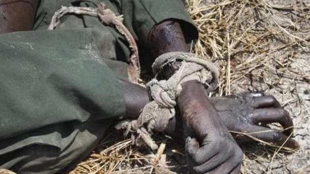 FILE - In this Sunday, Oct. 16, 2016 file photo, the body of a rebel soldier who died in a battle days before has his hands tied, in Malakal, South Sudan. The latest report on human rights abuses in South Sudan's five-year civil war, released by a United Nations commission Friday, Feb. 23, 2018 says it has identified more than 40 senior military officials "who may bear individual responsibility for war crimes." (AP Photo/Justin Lynch, File) (AP) FILE - In this Sunday, Oct. 16, 2016 file photo, the body of a rebel soldier who died in a battle days before has his hands tied, in Malakal, South Sudan. The latest report on human rights abuses in South Sudan's five-year civil war, released by a United Nations commission Friday, Feb. 23, 2018 says it has identified more than 40 senior military officials "who may bear individual responsibility for war crimes." (AP Photo/Justin Lynch, File) (AP)