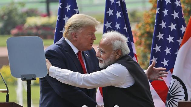 US President Donald Trump and Indian Prime Minister Narendra Modi embrace after giving a joint statement in New Delhi in February.(AP File)