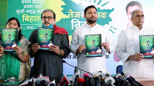RJD leader Tejashwi Yadav with party MP Manoj Jha and others releases party manifesto for Bihar assembly election at party office, in Patna on Saturday. (ANI Photo) RJD leader Tejashwi Yadav with party MP Manoj Jha and others releases party manifesto for Bihar assembly election at party office, in Patna on Saturday. (ANI Photo)