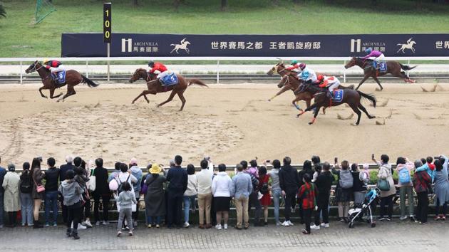 Spectators watch as horses compete during the China-Wuhan International Horse Racing Festival in Wuhan, China on October 24. Despite the Asian spikes, the region overall has reported improvement in handling the pandemic in recent weeks, with daily caseloads slowing even in India - a sharp contrast to the resurgence being seen in Europe and North America. (AFP)