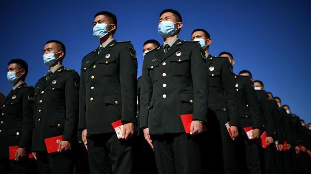 Paramilitary police officers stand in formation outside the Great Hall of the People in Beijing, China on October 23. Asia crossed 10 million infections of the coronavirus on October 24, accounting now for the second-heaviest regional toll in the world, according to a Reuters tally based on official reporting of cases by countries. (Noel Celis / AFP)