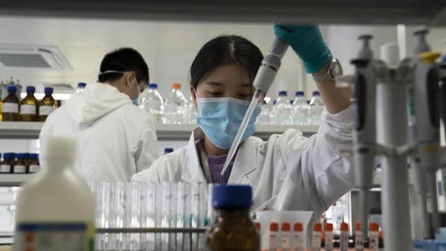 An employee of Sinovac works in a lab at a factory producing its SARS-CoV-2 vaccine for COVID-19 named CoronaVac in Beijing. China is rapidly increasing the number of people receiving its experimental coronavirus vaccines, with a city offering one to the general public and a biotech company providing another free to students going abroad. (AP Photo/Ng Han Guan, File) An employee of Sinovac works in a lab at a factory producing its SARS-CoV-2 vaccine for COVID-19 named CoronaVac in Beijing. China is rapidly increasing the number of people receiving its experimental coronavirus vaccines, with a city offering one to the general public and a biotech company providing another free to students going abroad. (AP Photo/Ng Han Guan, File)