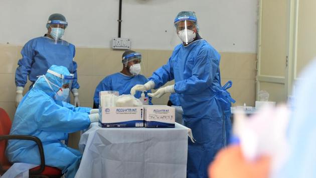 Health workers in PPE coveralls pictured during coronavirus testing. (Raj K Raj/HT PHOTO) Health workers in PPE coveralls pictured during coronavirus testing. (Raj K Raj/HT PHOTO)