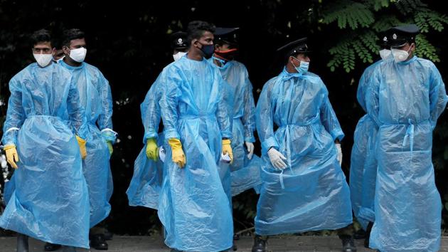 Police officers wearing protective gear stand in formation near the Sri Lankan parliament.(REUTERS) Police officers wearing protective gear stand in formation near the Sri Lankan parliament.(REUTERS)