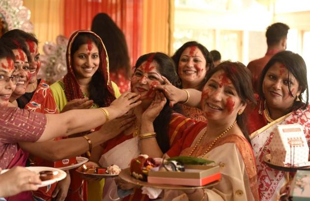 Sweets and sindoor are a part of the celebration and ritual of Durga Puja. (Praveen Kumar/HT Photos)