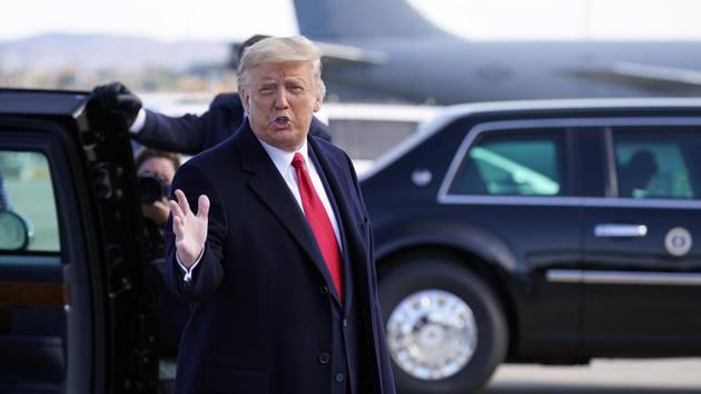 President Donald Trump gestures to reporters as he steps off Air Force One at Bangor International Airport. (AP) President Donald Trump gestures to reporters as he steps off Air Force One at Bangor International Airport. (AP)