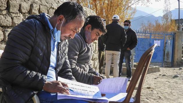 Polling officials during the Ladakh Autonomous Hill Development Council elections, in Leh, on October 22. (PTI) Polling officials during the Ladakh Autonomous Hill Development Council elections, in Leh, on October 22. (PTI)