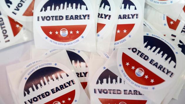 Stickers seen at a polling station in The Bronx, New York City on October 25. Millions of Americans wary of crowded polling booths during the coronavirus pandemic and energized by an election fight that both President Donald Trump and his Democratic rival Joe Biden have framed as existential are smashing records for casting ballots, whether by mail or in person. (Andrew Kelly / REUTERS)