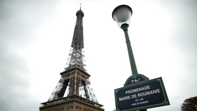 The Promenade Marie de Roumanie plaque is pictured in front of the Eiffel Tower in Paris, France.(REUTERS)