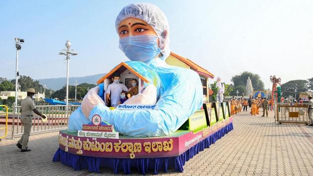 A tableau depicting corona warriors seen during the Dasara celebrations at Mysuru Palace in Mysuru on October 26. India’s current Covid-19 caseload stands at the second-highest after the United States but the country is experiencing a decline from its first wave peaks whereas rising cases in the US spell a third wave of infections. (PTI)