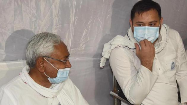 RJD leader Tejashwi Yadav (right) interacts with Bihar Chief Minister Nitish Kumar during ‘Shradh Karma’ function of former Union Minister Ram Vilas Paswan, at Lok Janshakti Party (LJP) office, in Patna on October 20, 2020. (Photo by Santosh Kumar/ Hindustan Times)