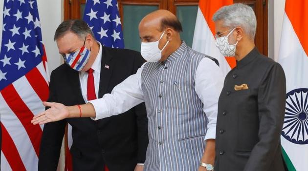 Defence Minister Rajnath Singh gestures to show the way to US Secretary of State Mike Pompeo, after they posed for a picture with External Affairs Minister S Jaishankar and US Defense Secretary Mark Esper ahead of their meeting at Hyderabad House in New Delhi.(REUTERS PHOTO.)