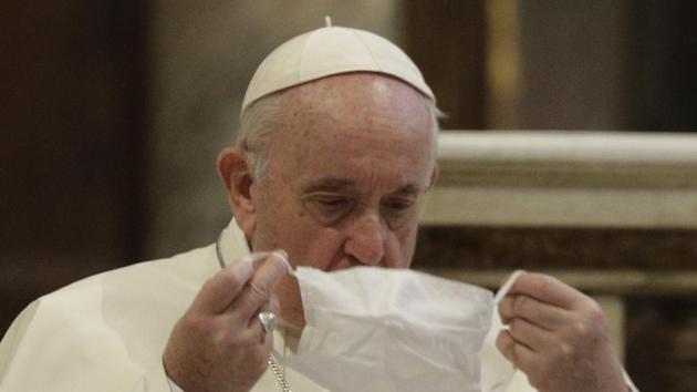 Pope Francis puts on his face mask as he attends an inter-religious ceremony for peace in the Basilica of Santa Maria in Aracoeli, in Rome. (AP) Pope Francis puts on his face mask as he attends an inter-religious ceremony for peace in the Basilica of Santa Maria in Aracoeli, in Rome. (AP)