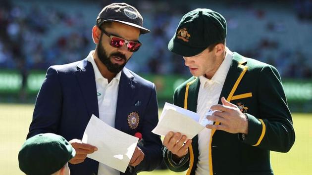 Virat Kohli and Tim Paine at the toss.(Getty Images) Virat Kohli and Tim Paine at the toss.(Getty Images)