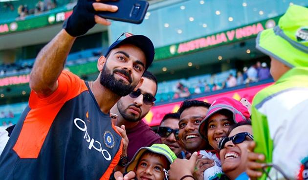 Indian captain Virat Kohli takes a selfie with the crowd.(Getty Images)