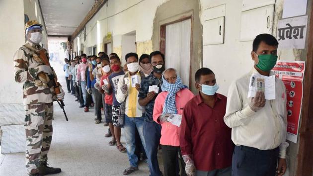 People stand in a queue to cast their votes during the first phase of Bihar assembly polls, in Gaya, Bihar.(PTI) People stand in a queue to cast their votes during the first phase of Bihar assembly polls, in Gaya, Bihar.(PTI)