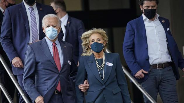 Democratic presidential nominee Joe Biden and his wife Jill Biden depart the Delaware State Building after casting their ballots for the general election on October 28.(AFP)