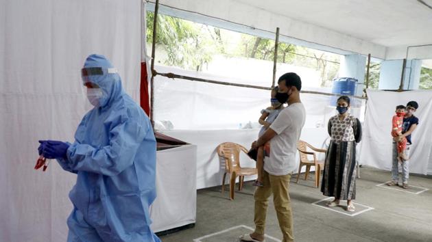 A health worker working at one of the Covid-19 testing centre at Katraj in Pune, India. (HT PHOTO) A health worker working at one of the Covid-19 testing centre at Katraj in Pune, India. (HT PHOTO)