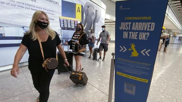 Passengers at London’s Heathrow Airport (Yui Mok/PA via AP) Passengers at London’s Heathrow Airport (Yui Mok/PA via AP)