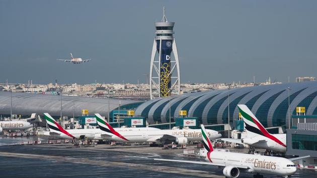 FILE - In this Dec. 11, 2019 file photo, an Emirates jetliner comes in for landing at Dubai International Airport in Dubai, United Arab Emirates. The airport is getting busier but it’s a long way from what it once was amid the coronavirus pandemic. To boost those numbers, airport CEO Paul Griffiths is urging countries to move away from mandatory quarantines on arriving passengers and toward the strategy embraced by Dubai. That includes aggressive coronavirus testing before departure, followed by mandatory mask-wearing on aircraft.(AP) FILE - In this Dec. 11, 2019 file photo, an Emirates jetliner comes in for landing at Dubai International Airport in Dubai, United Arab Emirates. The airport is getting busier but it’s a long way from what it once was amid the coronavirus pandemic. To boost those numbers, airport CEO Paul Griffiths is urging countries to move away from mandatory quarantines on arriving passengers and toward the strategy embraced by Dubai. That includes aggressive coronavirus testing before departure, followed by mandatory mask-wearing on aircraft.(AP)