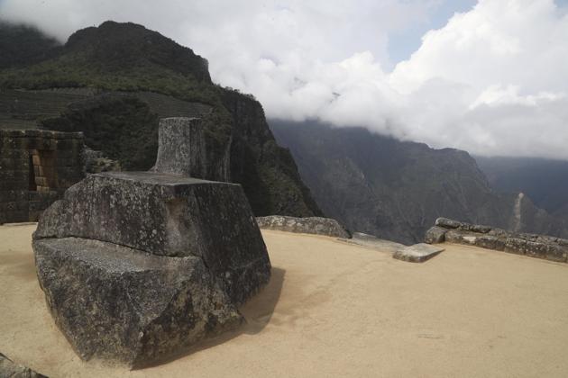 The famous sundial "Intihuatana" stands at the empty Machu Picchu archeological site, devoid of tourists while it's closed amid the COVID-19 pandemic, in the department of Cusco, Peru, Tuesday, Oct. 27, 2020. Currently open to maintenance workers only, the world-renown Incan citadel of Machu Picchu will reopen to the public on Nov. 1. (AP Photo/Martin Mejia) (AP)
