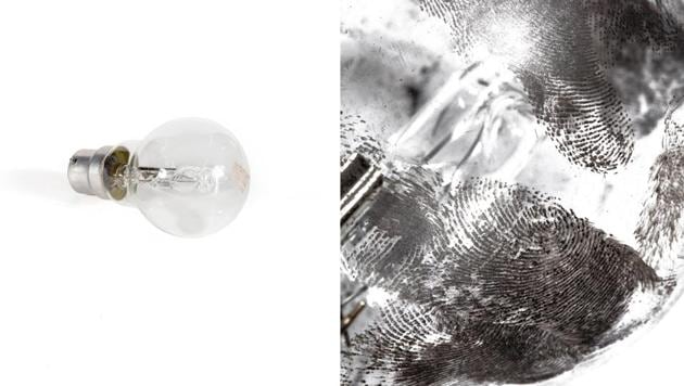 A regular light bulb and the fingerprints on it, as photographed by Lewis Bush in his photozine “Latent Labour.” (Lewis Bush)